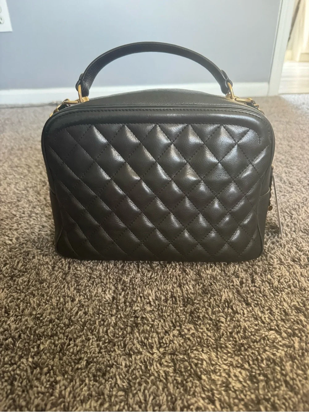 CHANEL Calfskin Quilted CC Vanity Case in black with gold hardware
